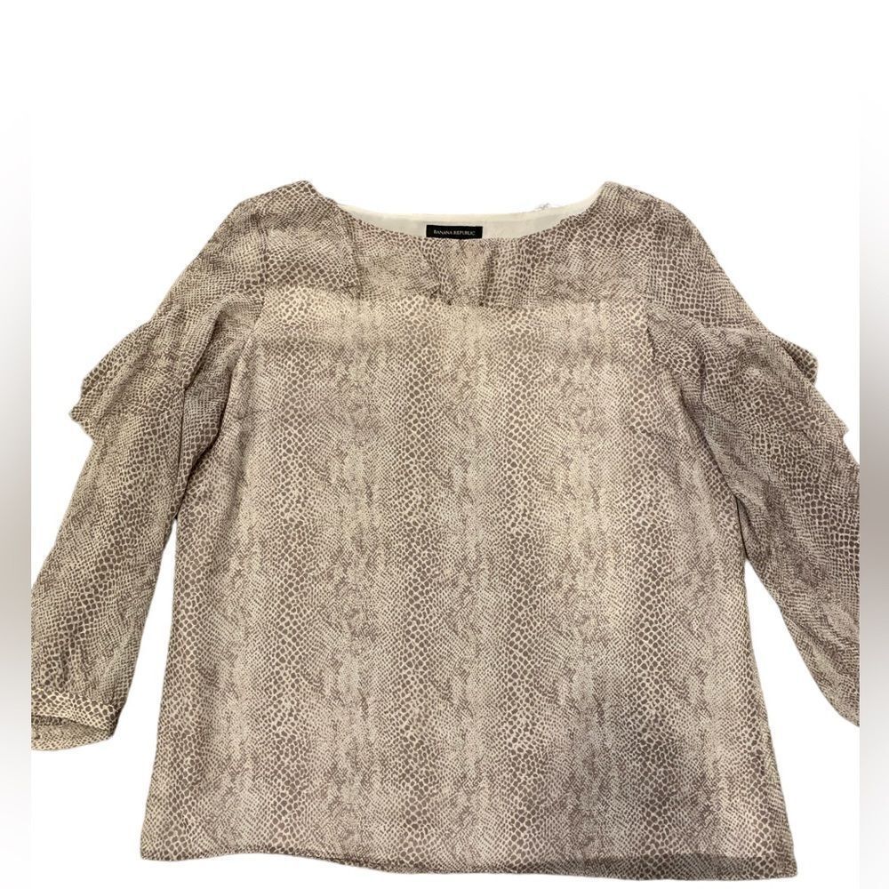 Banana Republic blouse. Size: XL. Ruffles at the neckline and shoulders.  Lined.